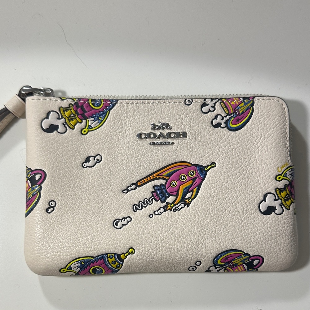 Coach Cream Wristlet with Vibrant Rocket Design